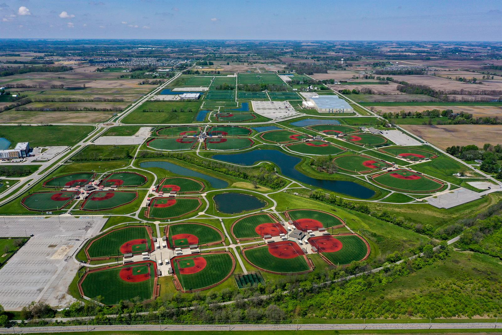 Aerial view of Grand Park Sports Campus in Westfield, Indiana, showing multiple sports fields under a clear sky.